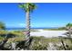 Scenic beach view with palm trees and ocean at 915 Seaside Dr # 312 Weeks 16-17, Sarasota, FL 34242