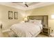 Guest bedroom with full-size bed and wood headboard at 915 Seaside Dr # 312 Weeks 16-17, Sarasota, FL 34242