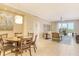 Open concept dining area with table and chairs, and living room at 915 Seaside Dr # 312 Weeks 16-17, Sarasota, FL 34242