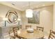 Elegant dining room with a round table and four chairs at 915 Seaside Dr # 312 Weeks 16-17, Sarasota, FL 34242