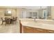 Kitchen features a breakfast bar and view into dining area at 915 Seaside Dr # 312 Weeks 16-17, Sarasota, FL 34242