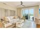 Living room with sofa and chairs, and access to balcony at 915 Seaside Dr # 312 Weeks 16-17, Sarasota, FL 34242