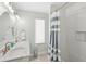 Clean bathroom with marble countertop and shower/tub combo at 1125 N Moonmist Ct # L5, Sarasota, FL 34242