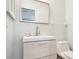 Updated bathroom with modern vanity and toilet at 1125 N Moonmist Ct # L5, Sarasota, FL 34242