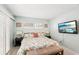 Spacious bedroom with king bed and flat-screen TV at 1125 N Moonmist Ct # L5, Sarasota, FL 34242