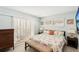 King-size bedroom with coastal decor and plenty of natural light at 1125 N Moonmist Ct # L5, Sarasota, FL 34242
