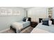 Twin bedroom with coastal decor and plenty of natural light at 1125 N Moonmist Ct # L5, Sarasota, FL 34242