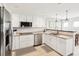 Bright kitchen featuring stainless steel appliances and granite countertops at 1125 N Moonmist Ct # L5, Sarasota, FL 34242