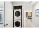 Convenient laundry room with stackable washer and dryer at 1125 N Moonmist Ct # L5, Sarasota, FL 34242