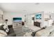 Spacious living area with comfortable seating, a large TV, and open floor plan at 1125 N Moonmist Ct # L5, Sarasota, FL 34242