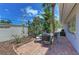 Relaxing patio with brick paving, outdoor seating, and grill at 1125 N Moonmist Ct # L5, Sarasota, FL 34242