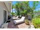 Relaxing patio with lounge chairs and lush greenery at 1125 N Moonmist Ct # L5, Sarasota, FL 34242