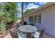 Relaxing patio with brick paving, outdoor seating, and grill at 1125 N Moonmist Ct # L5, Sarasota, FL 34242