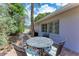 Relaxing patio with brick paving, outdoor seating, and grill at 1125 N Moonmist Ct # L5, Sarasota, FL 34242