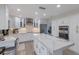 Modern kitchen with white cabinets, marble countertops, and island at 1211 N View Dr, Sarasota, FL 34242