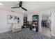 Playroom with built-in shelving, comfortable seating area, and an adjacent office space at 1211 N View Dr, Sarasota, FL 34242