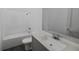 Bathroom with a bathtub, sink, and gray vanity at 13036 Cedar Elm Lane, Parrish, FL 34219