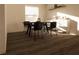 Simple dining area with black chairs and a white buffet at 13036 Cedar Elm Lane, Parrish, FL 34219