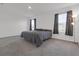 Spacious bedroom with gray carpet and windows at 16938 Trite Bend St, Wimauma, FL 33598