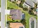 An aerial view showcases the house, pool, and surrounding well-maintained neighborhood at 1743 Pinyon Pine Dr, Sarasota, FL 34240