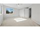 Bright bedroom with a large window, ceiling fan and carpeted flooring at 1743 Pinyon Pine Dr, Sarasota, FL 34240