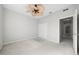 Cozy bedroom featuring a ceiling fan and large closet at 1743 Pinyon Pine Dr, Sarasota, FL 34240