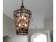 Close-up of an ornate chandelier with leaf details at 1743 Pinyon Pine Dr, Sarasota, FL 34240