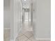 Bright hallway featuring decorative tile flooring and neutral paint at 1743 Pinyon Pine Dr, Sarasota, FL 34240