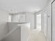 Bright hallway with carpet flooring and white trim at 1743 Pinyon Pine Dr, Sarasota, FL 34240