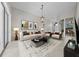 Bright living room featuring modern decor, stylish furnishings, and a decorative chandelier at 1743 Pinyon Pine Dr, Sarasota, FL 34240