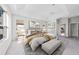 Spacious main bedroom features tray ceiling, natural light, and a sitting area with bench at 1743 Pinyon Pine Dr, Sarasota, FL 34240