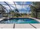 Sparkling pool with attached spa and screened enclosure provides a private outdoor oasis at 1743 Pinyon Pine Dr, Sarasota, FL 34240