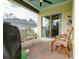 Covered patio with brick flooring, comfortable seating and outdoor ceiling fan at 1877 Dragonfly Ave, North Port, FL 34288