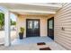 Exterior view of the home entrance, with a gravel walkway at 2326 Gull Ln, Sarasota, FL 34237