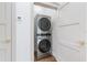 Efficient laundry area features a stacked washer and dryer for space-saving convenience at 2326 Gull Ln, Sarasota, FL 34237