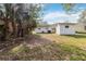 Backyard with shed and mature trees at 2410 13Th W St, Palmetto, FL 34221