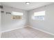 Spacious bedroom with tile floors and two windows at 2410 13Th W St, Palmetto, FL 34221