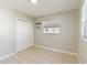 Bright bedroom with tile floors and double door closet at 2410 13Th W St, Palmetto, FL 34221