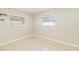 Well-lit bedroom with tile floors and two windows at 2410 13Th W St, Palmetto, FL 34221