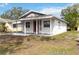 Newly renovated home showcasing a clean, light-colored exterior at 2410 13Th W St, Palmetto, FL 34221