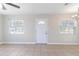 Bright and airy living room featuring tile floors and ample natural light at 2410 13Th W St, Palmetto, FL 34221