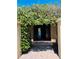 Inviting front entrance adorned with flowering vines, leading into a home with character at 2961 Homasassa Rd, Sarasota, FL 34239