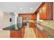 Kitchen boasting stainless steel appliances, granite countertops, and ample cabinet space at 2961 Homasassa Rd, Sarasota, FL 34239