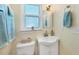 Clean bathroom with single sink vanity, toilet, and shower at 300 Coral Rd, Venice, FL 34293