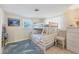 Bedroom with bunk beds, dresser, and coastal-themed rug at 300 Coral Rd, Venice, FL 34293