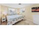 Bedroom with king-size bed, nightstands, and coastal-themed decor at 300 Coral Rd, Venice, FL 34293