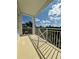 Balcony with white railings offering scenic views of the community at 3404 79Th Street W Cir # 203, Bradenton, FL 34209