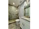 Bathroom with shower, toilet and vanity with granite top at 3404 79Th Street W Cir # 203, Bradenton, FL 34209