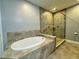 Spa-like bathroom with soaking tub and a large walk-in shower at 3404 79Th Street W Cir # 203, Bradenton, FL 34209