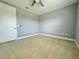 Bright bedroom with neutral walls and ceiling fan at 3404 79Th Street W Cir # 203, Bradenton, FL 34209